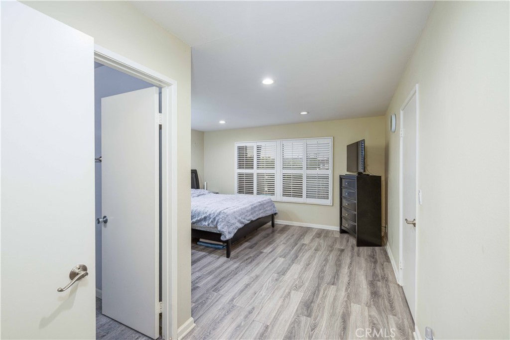 12279 Westcliff Drive Stanton, CA 90680 - Photo 15 of 26 a living room with a bed and a window