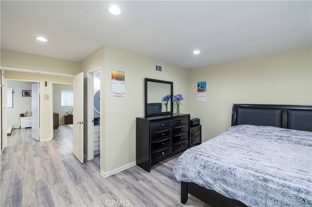12279 Westcliff Drive Stanton, CA 90680 - Photo 16 of 26 a bedroom with a bed and wooden floor