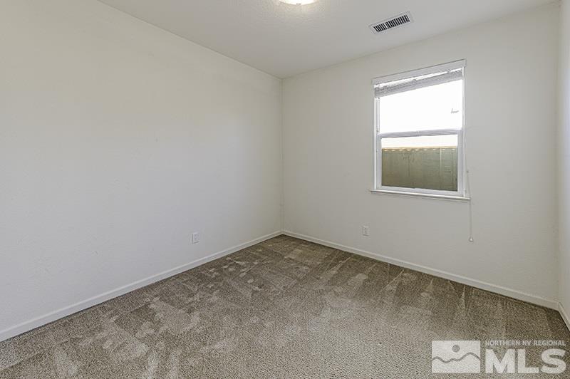 340 Manciano Way Reno, NV 89521 - Photo 11 of 15 an empty room with a window