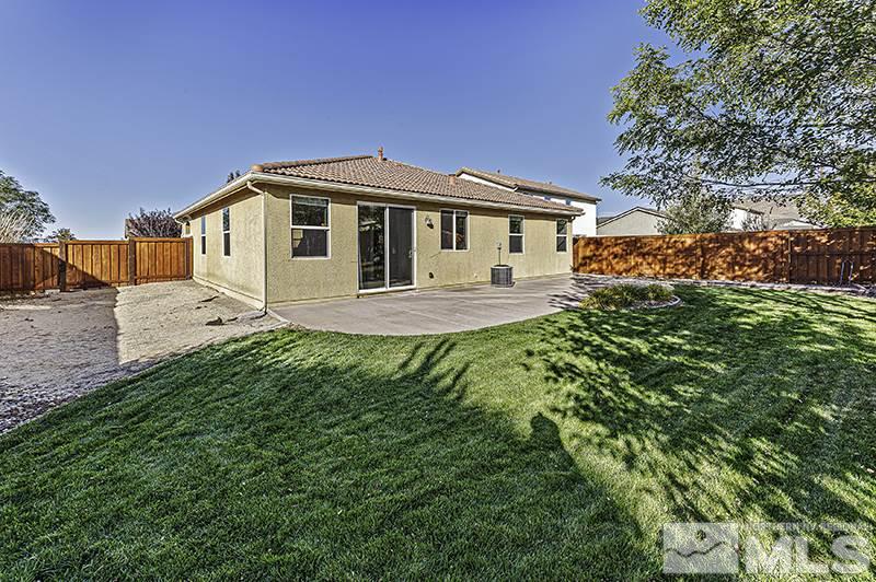 340 Manciano Way Reno, NV 89521 - Photo 14 of 15 a front view of a house with a yard