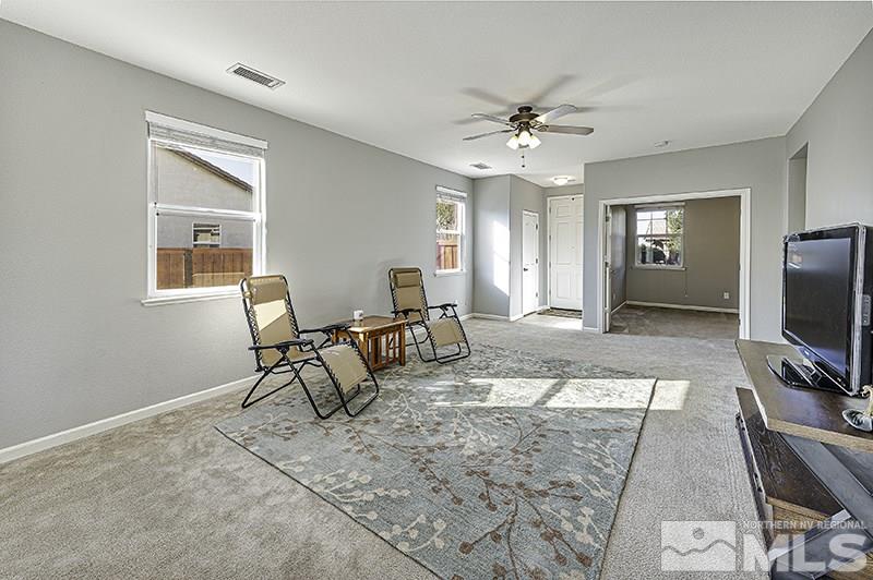 340 Manciano Way Reno, NV 89521 - Photo 3 of 15 a living room with furniture and a flat screen tv
