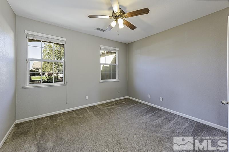 340 Manciano Way Reno, NV 89521 - Photo 7 of 15 a view of an empty room with a window