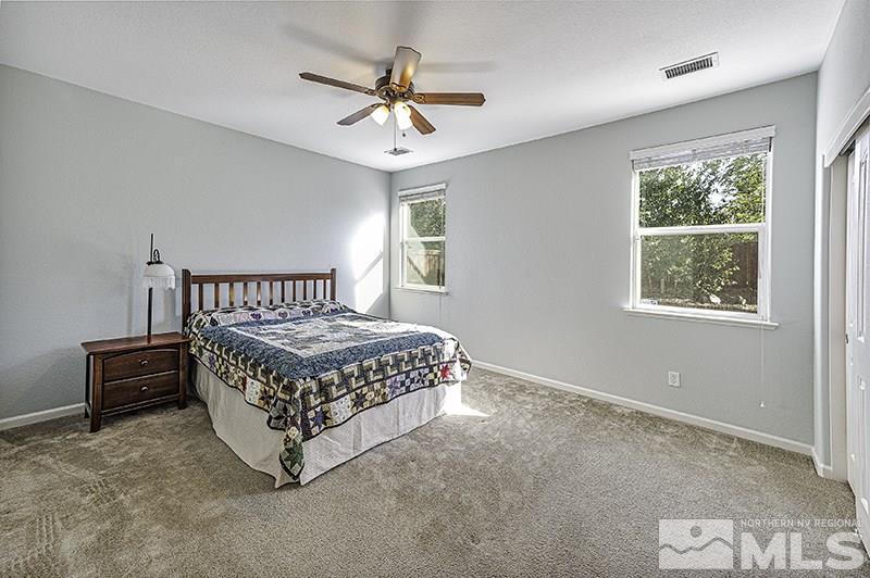 340 Manciano Way Reno, NV 89521 - Photo 8 of 15 a bedroom with a bed a window and closet