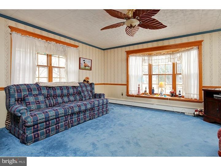 731 Iszard Road Deptford, NJ 08096 - Photo 14 of 20 a living room with furniture and a large window