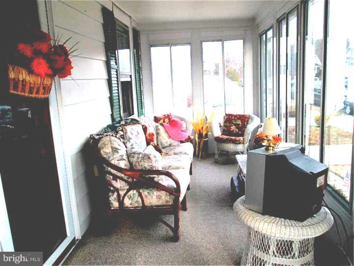 731 Iszard Road Deptford, NJ 08096 - Photo 8 of 20 a living room with furniture and a large window