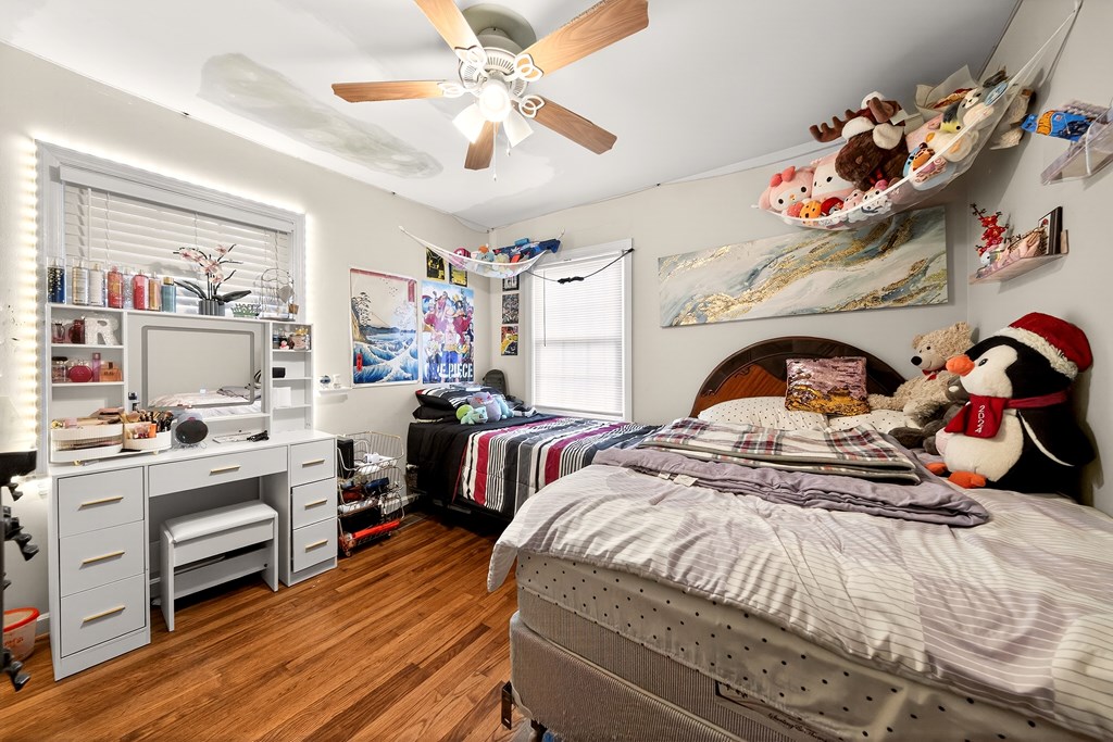 2963 Grant Road Columbus, GA 31907 - Photo 12 of 15 a bedroom with a bed and a chandelier