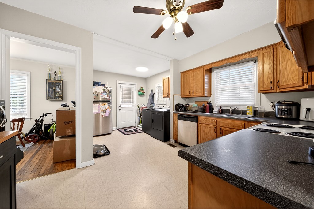 2963 Grant Road Columbus, GA 31907 - Photo 8 of 15 a kitchen with stainless steel appliances granite countertop a sink a stove and refrigerator