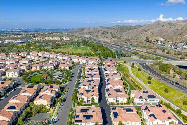 an aerial view of residential houses and outdoor space