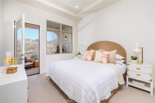 a bedroom with bed and window