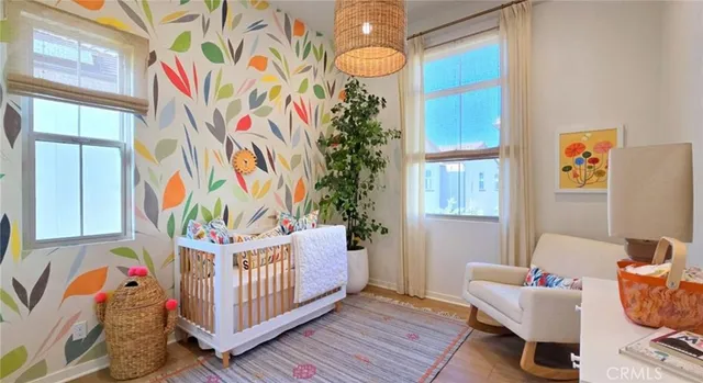 a bedroom with furniture and wooden floor