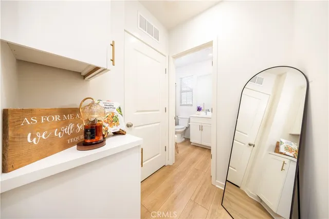 a bathroom with a sink a toilet and a shower