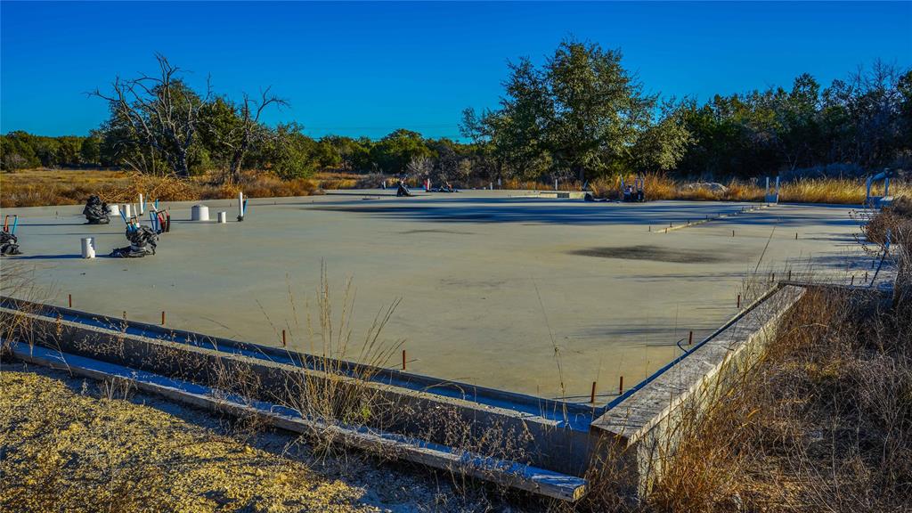 391 County Road 4717 Kempner, TX 76539 - Photo 30 of 40 a view of a pool with a table and chairs