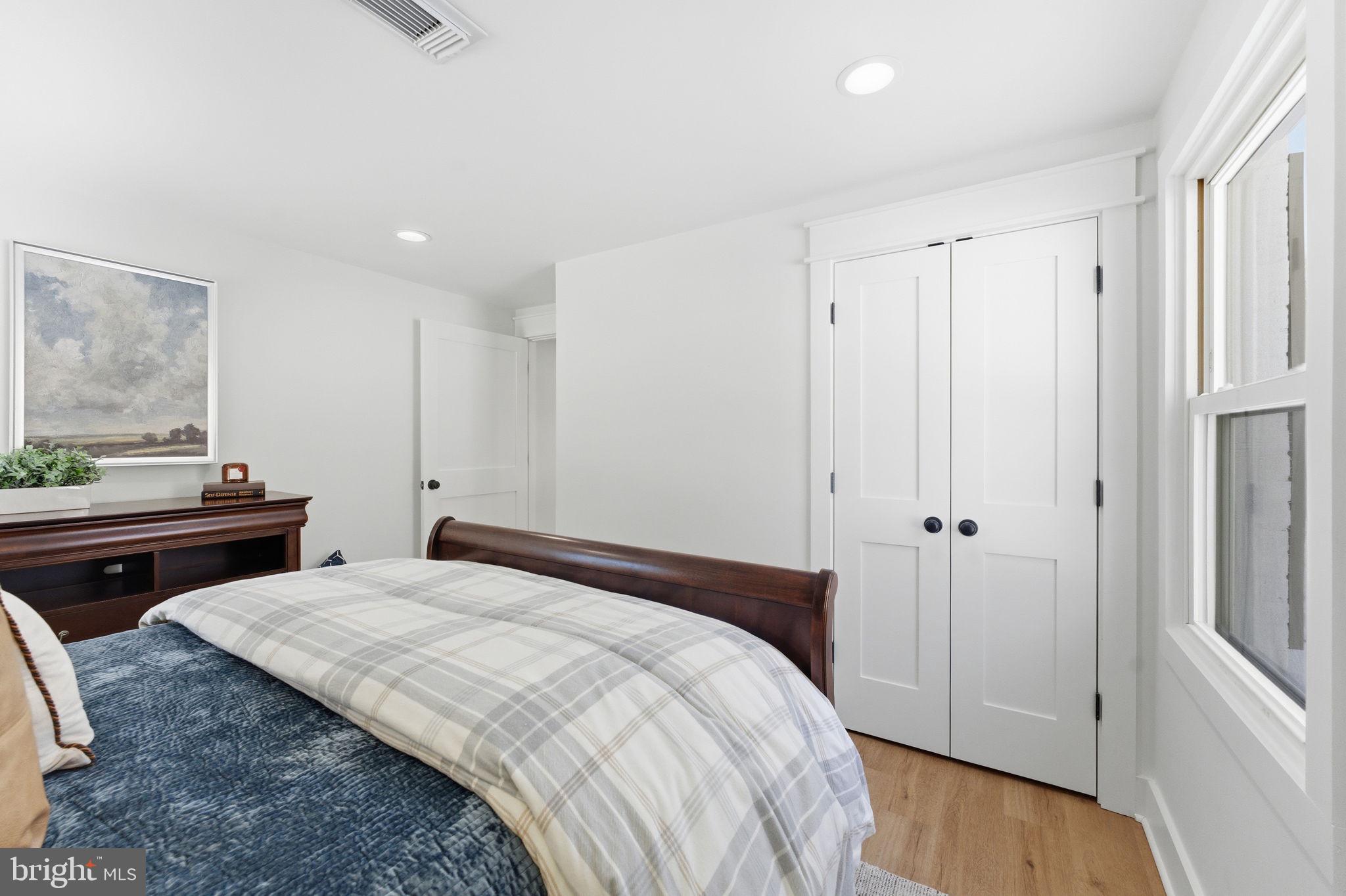 8615 Kerry Lane Springfield, VA 22152 - Photo 36 of 50 a bedroom with a bed and a dresser