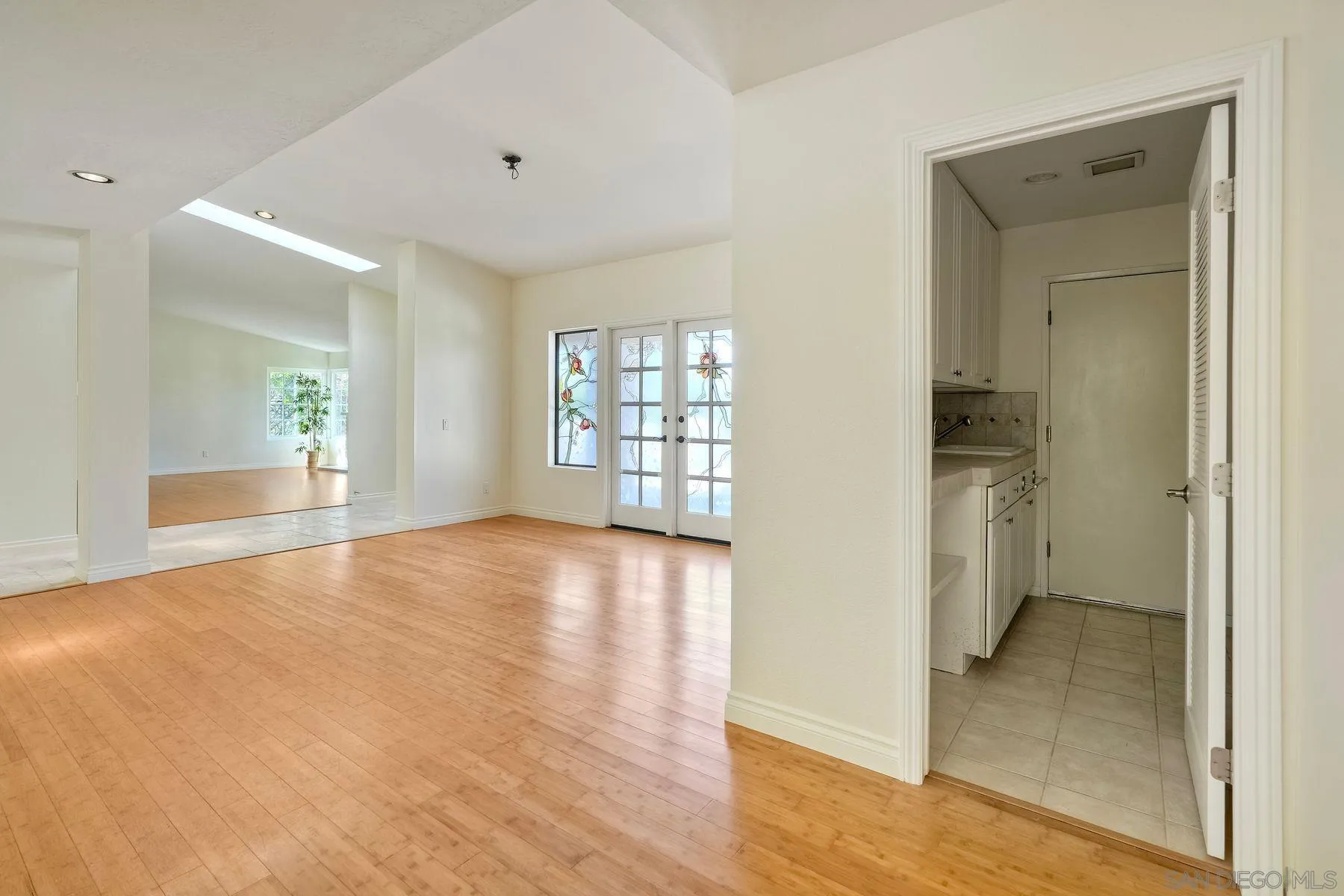 13145 Silver Saddle Lane Poway, CA 92064 - Photo 11 of 53 wooden floor in an empty room and a window