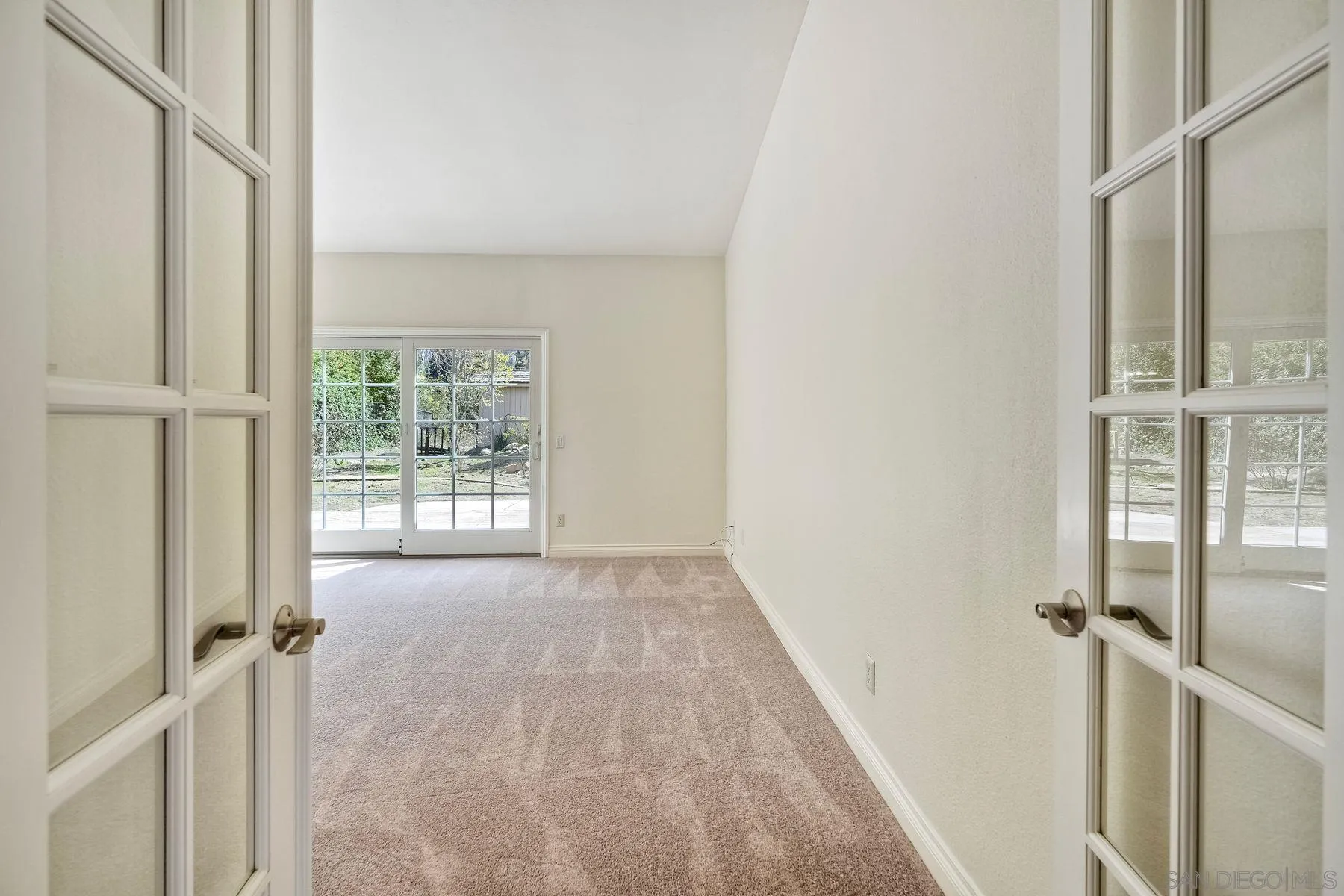 13145 Silver Saddle Lane Poway, CA 92064 - Photo 14 of 53 a view of an empty room with a window