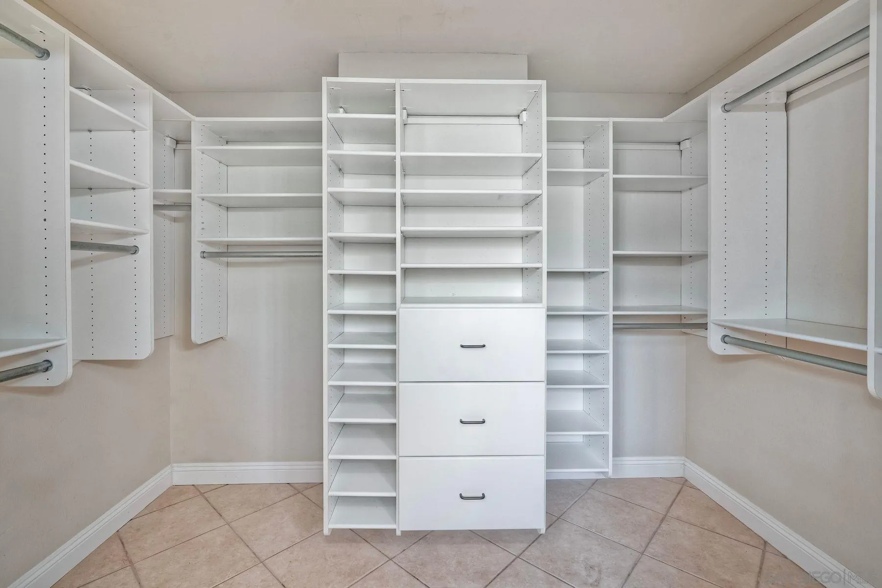 13145 Silver Saddle Lane Poway, CA 92064 - Photo 18 of 53 a view of walk in closet with empty racks