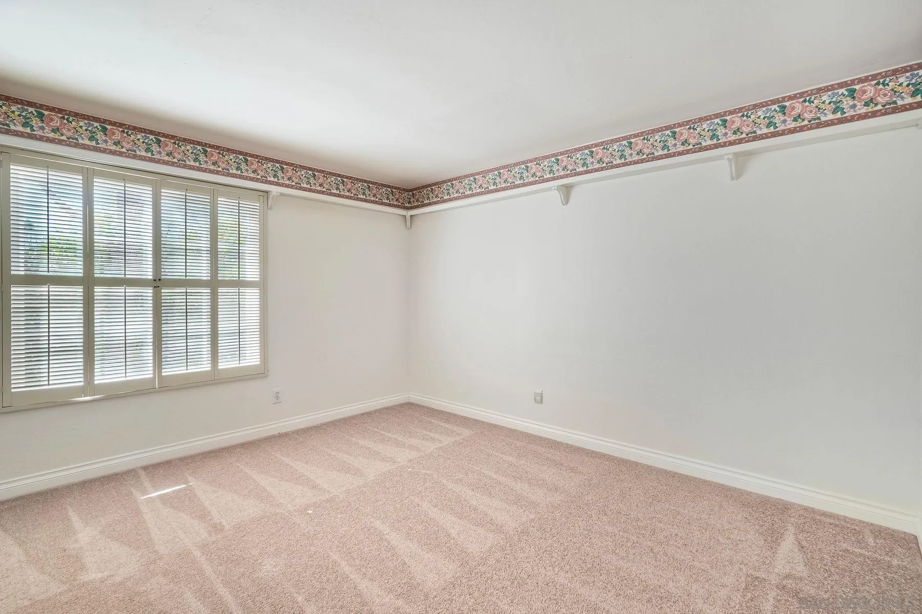 13145 Silver Saddle Lane Poway, CA 92064 - Photo 29 of 53 a view of an empty room with a window