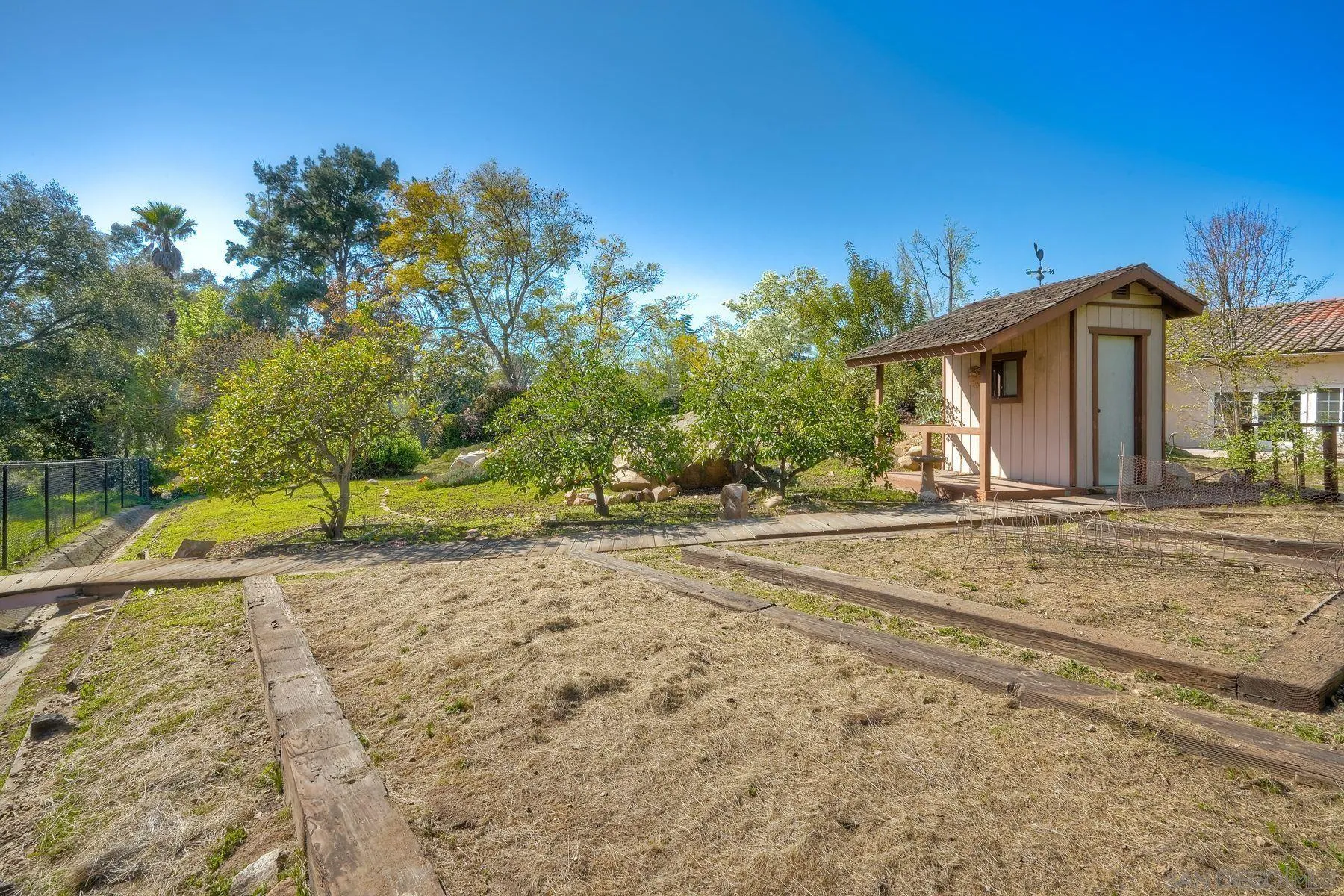 13145 Silver Saddle Lane Poway, CA 92064 - Photo 32 of 53 a view of a house with a yard
