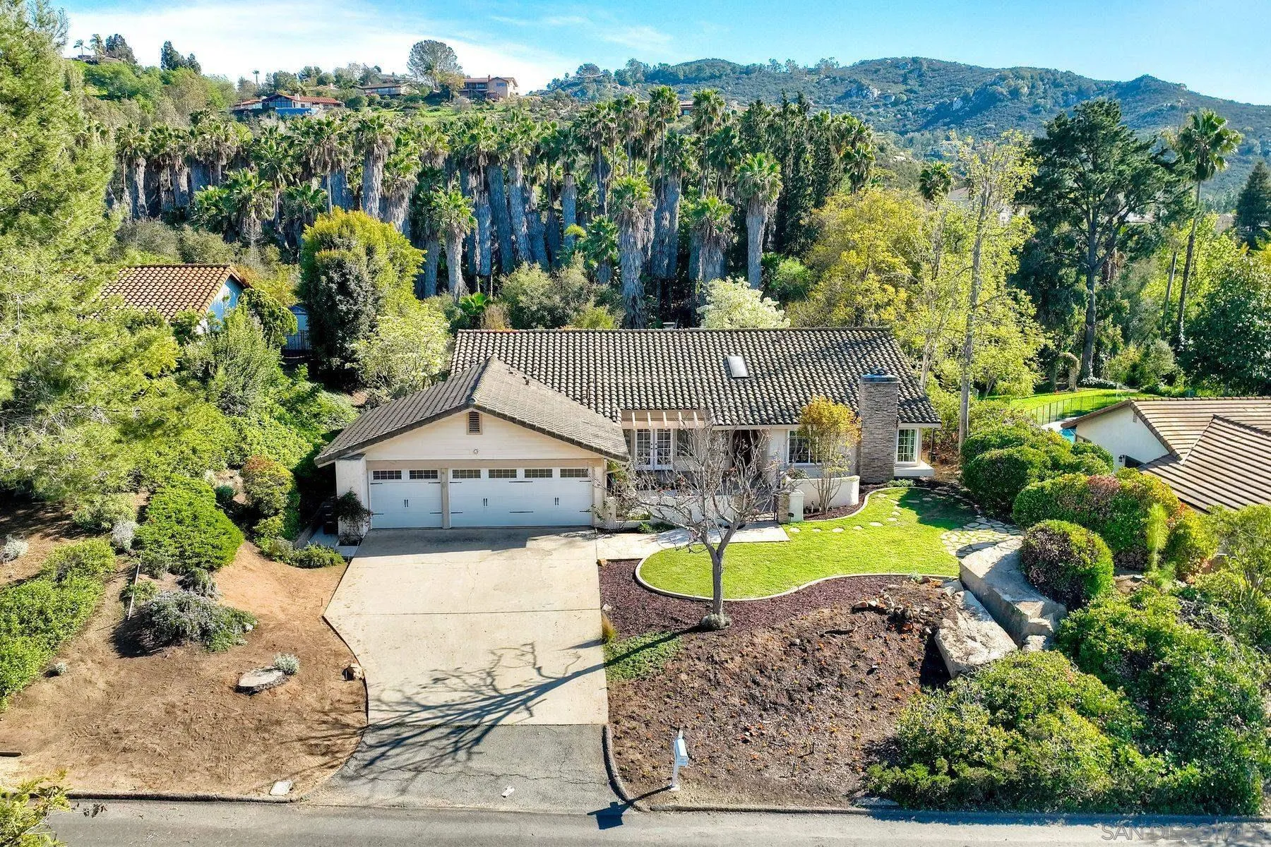 13145 Silver Saddle Lane Poway, CA 92064 - Photo 38 of 53 a view of a house with a yard and sitting area