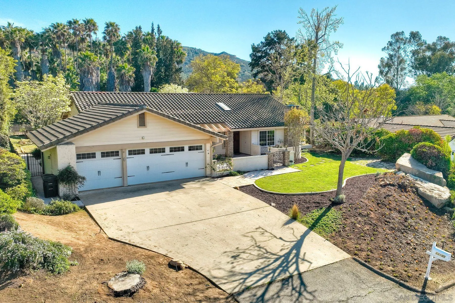 13145 Silver Saddle Lane Poway, CA 92064 - Photo 40 of 53 a view of a house with backyard and a slide