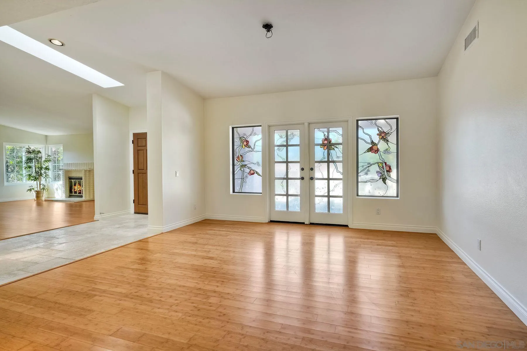 13145 Silver Saddle Lane Poway, CA 92064 - Photo 10 of 53 wooden floor in an empty room with a window