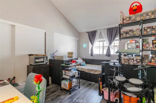 a living room with furniture a rug and white walls
