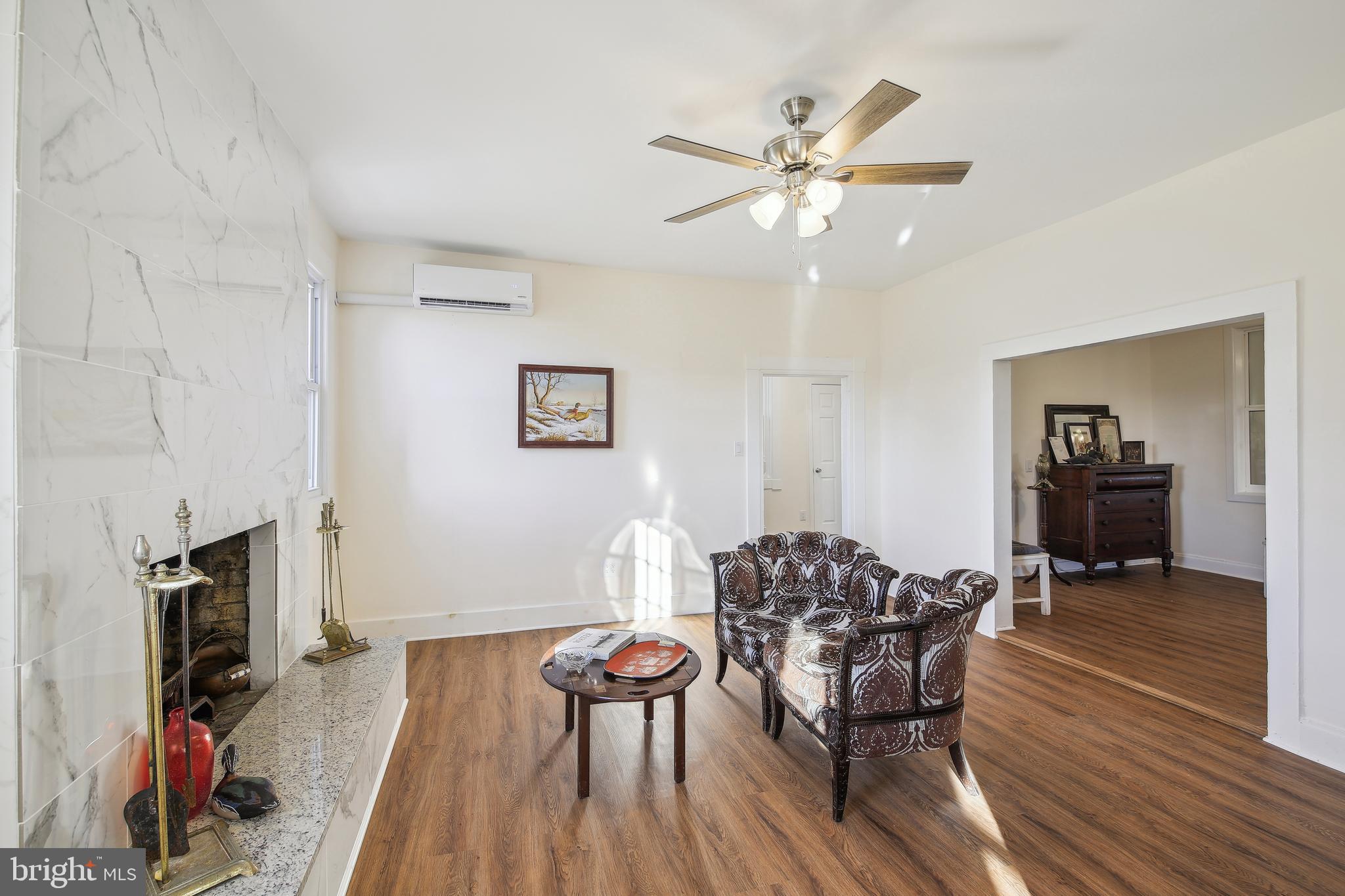 23391 Custom House Road Deal Island, MD 21821 - Photo 6 of 64 Living Room to Den and Hallway to Upstairs Rooms