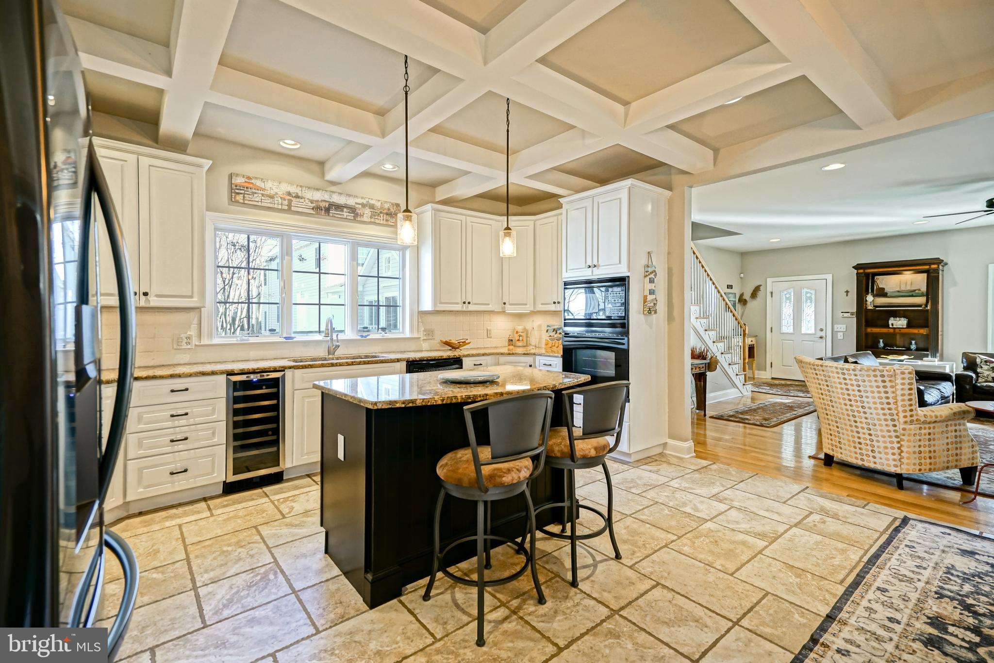 412 Mulberry Street Lewes, DE 19958 - Photo 14 of 74 a kitchen with stainless steel appliances kitchen island granite countertop a refrigerator and cabinets