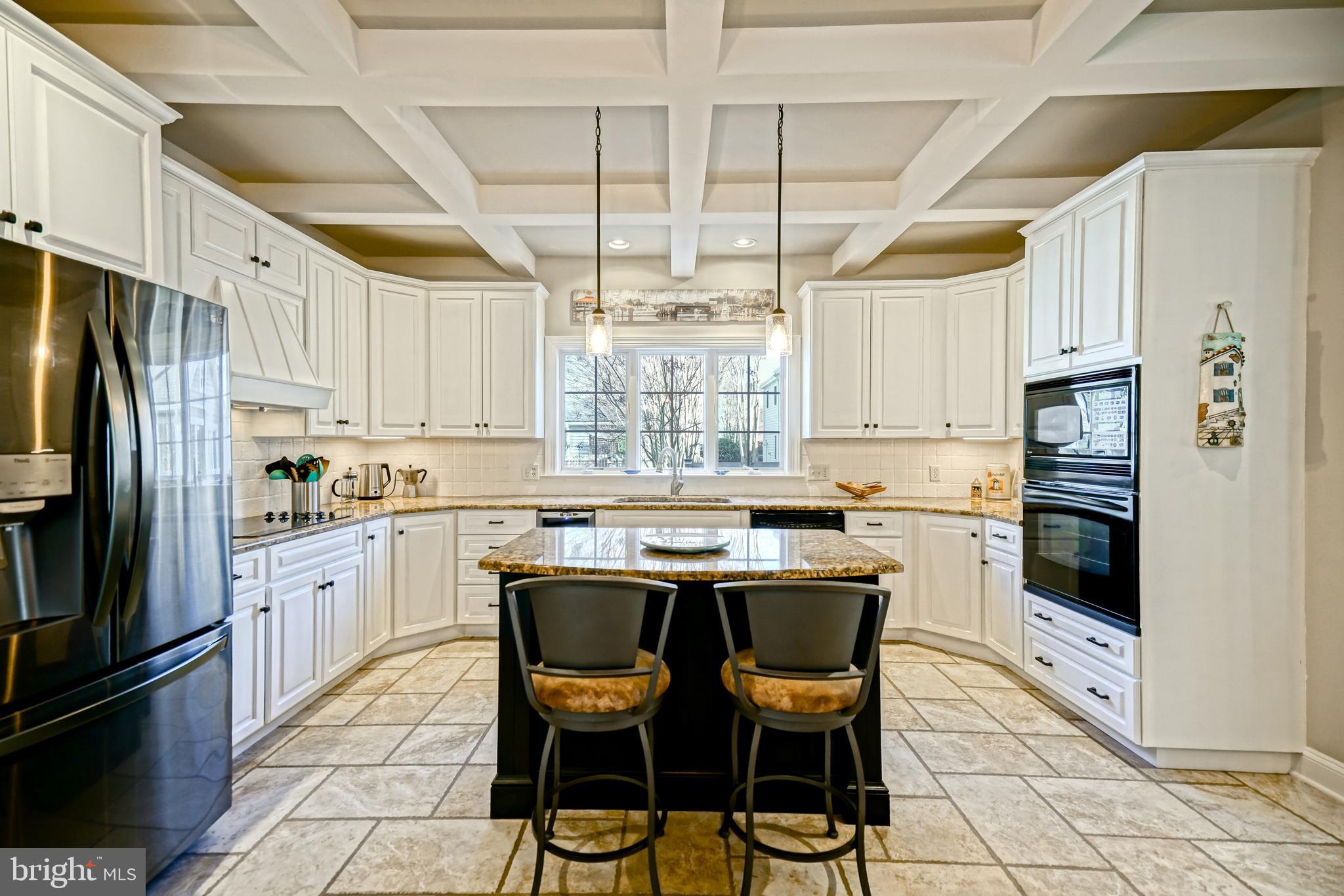412 Mulberry Street Lewes, DE 19958 - Photo 20 of 74 a kitchen with a refrigerator a stove a sink and white cabinets
