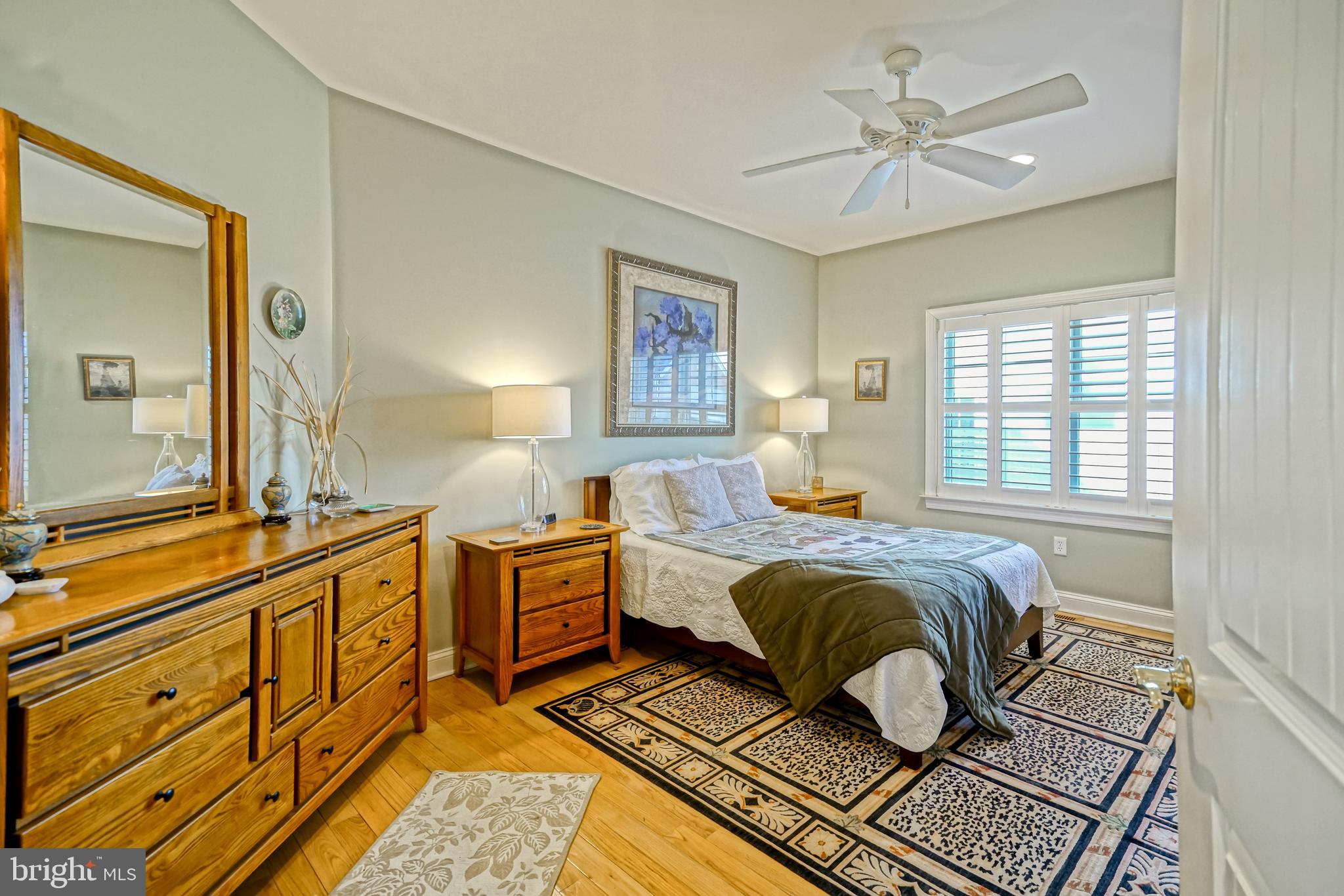 412 Mulberry Street Lewes, DE 19958 - Photo 24 of 74 a spacious bedroom with a bed and wooden floor