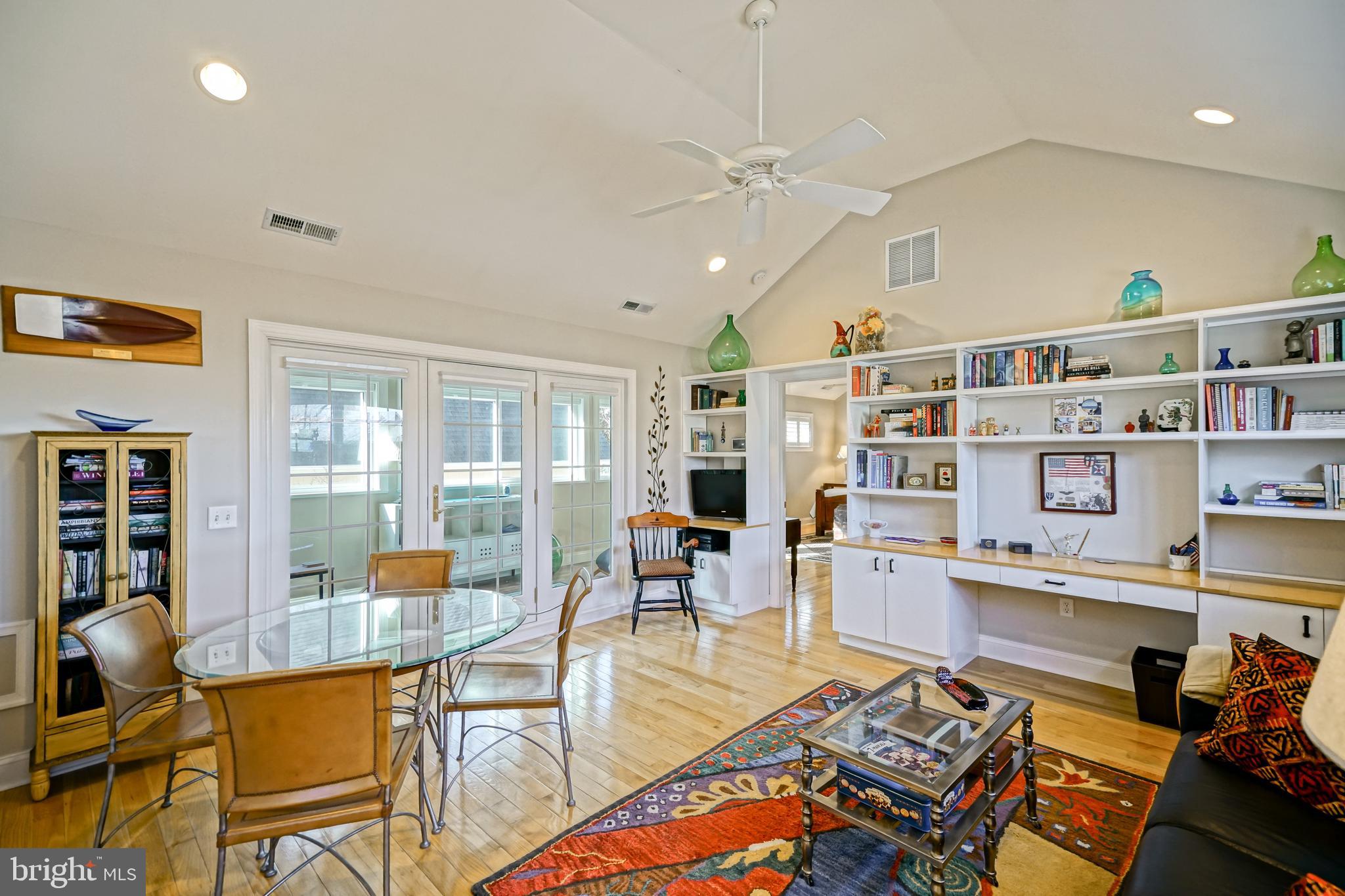 412 Mulberry Street Lewes, DE 19958 - Photo 33 of 74 a living room with furniture a rug and a chandelier