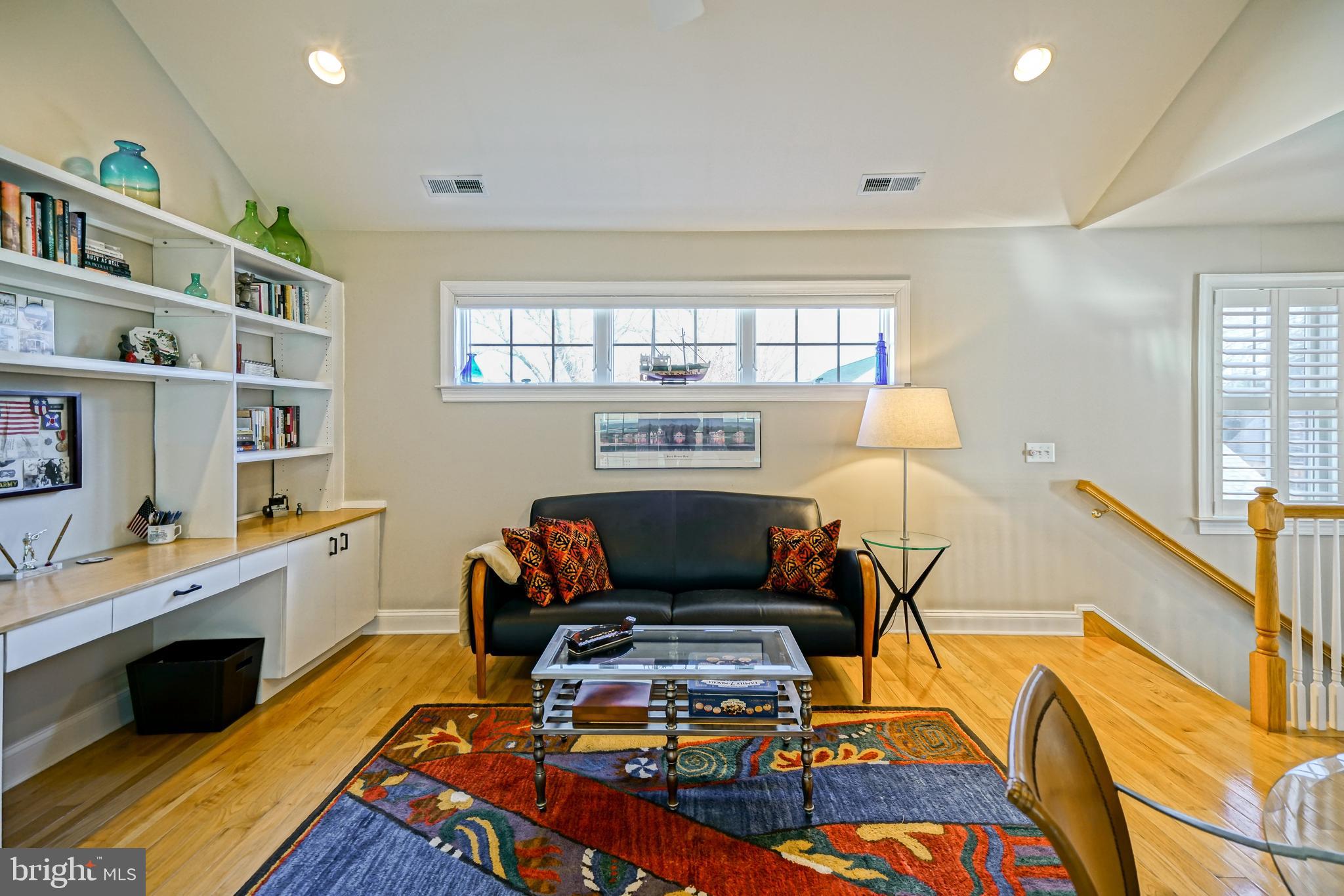412 Mulberry Street Lewes, DE 19958 - Photo 38 of 74 a living room with furniture fireplace and a window
