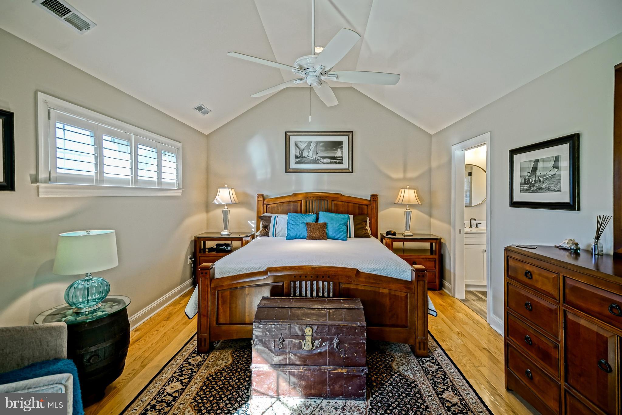 412 Mulberry Street Lewes, DE 19958 - Photo 40 of 74 a bedroom with a bed and a chandelier