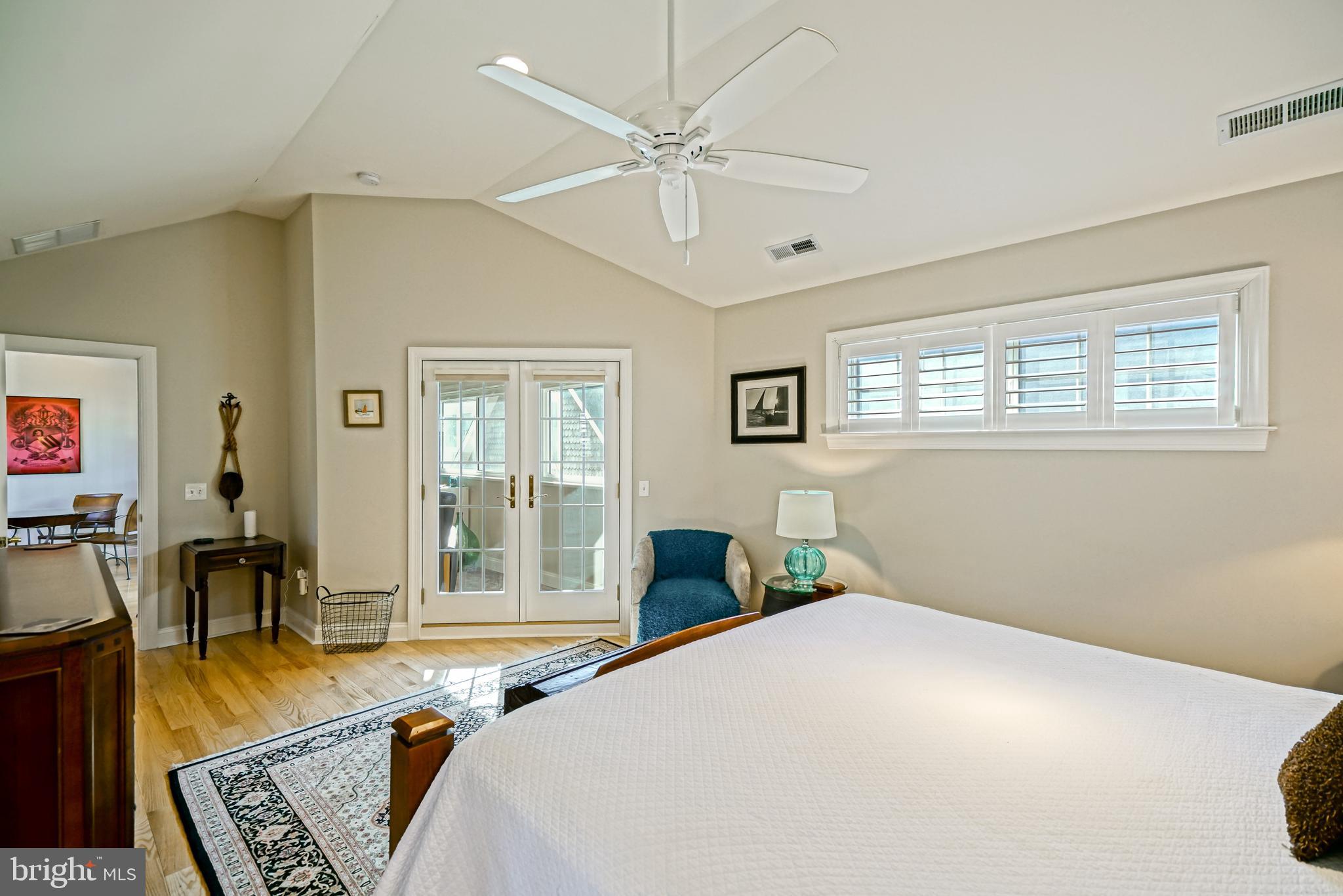 412 Mulberry Street Lewes, DE 19958 - Photo 48 of 74 a bedroom with a bed a table and chair with the outer view