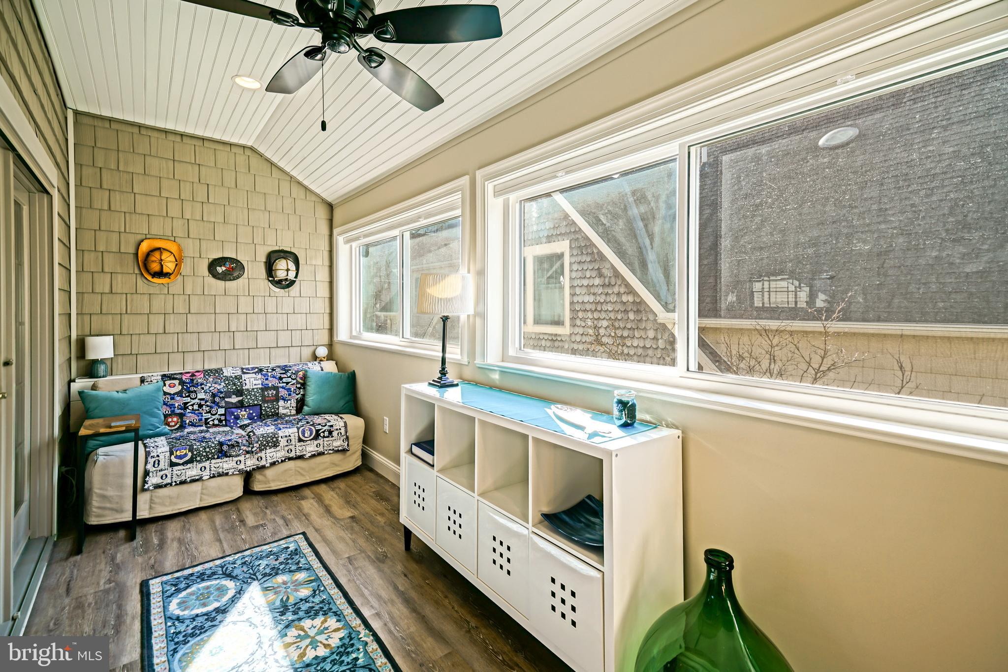 412 Mulberry Street Lewes, DE 19958 - Photo 51 of 74 a kitchen with stainless steel appliances kitchen island granite countertop a stove a sink and a dining table chair