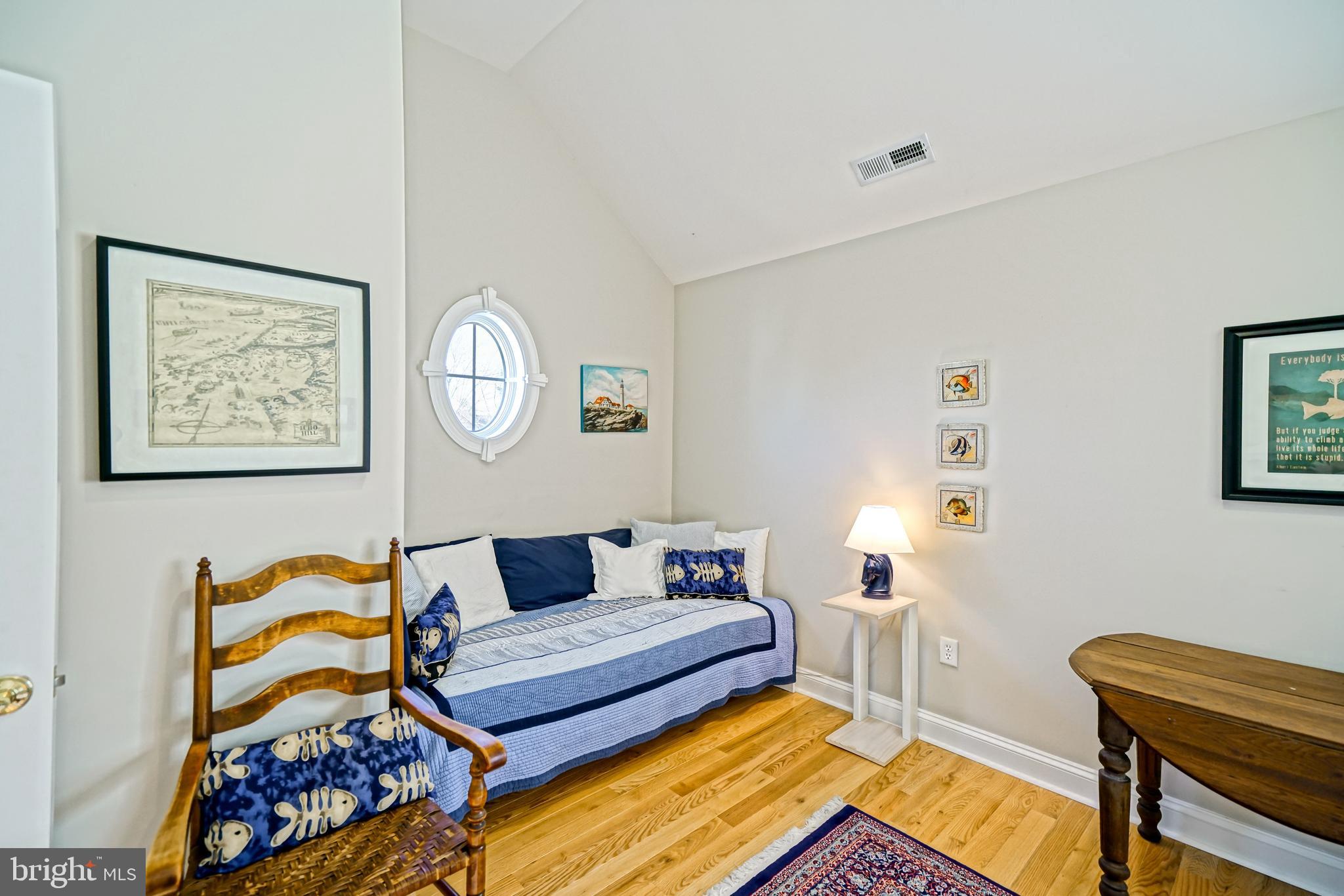 412 Mulberry Street Lewes, DE 19958 - Photo 57 of 74 a bedroom with a bed and wooden floor