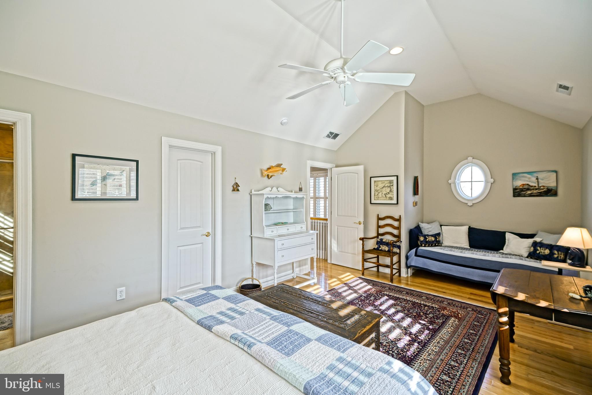 412 Mulberry Street Lewes, DE 19958 - Photo 58 of 74 a bedroom with a bed and a chandelier