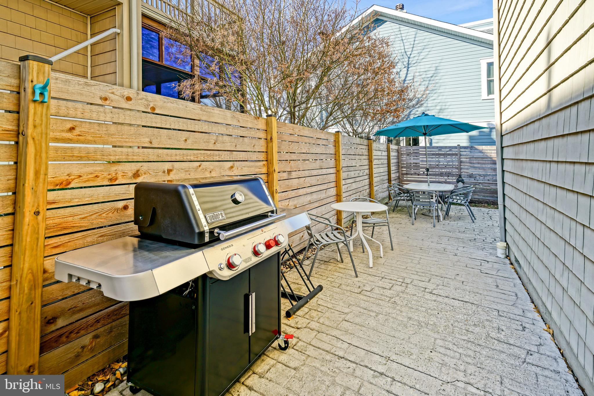 412 Mulberry Street Lewes, DE 19958 - Photo 65 of 74 a view of a patio with table and chairs with wooden floor
