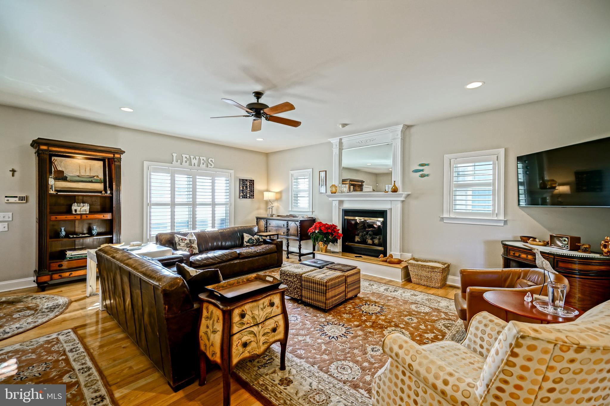 412 Mulberry Street Lewes, DE 19958 - Photo 7 of 74 a living room with furniture flat screen tv and a fireplace
