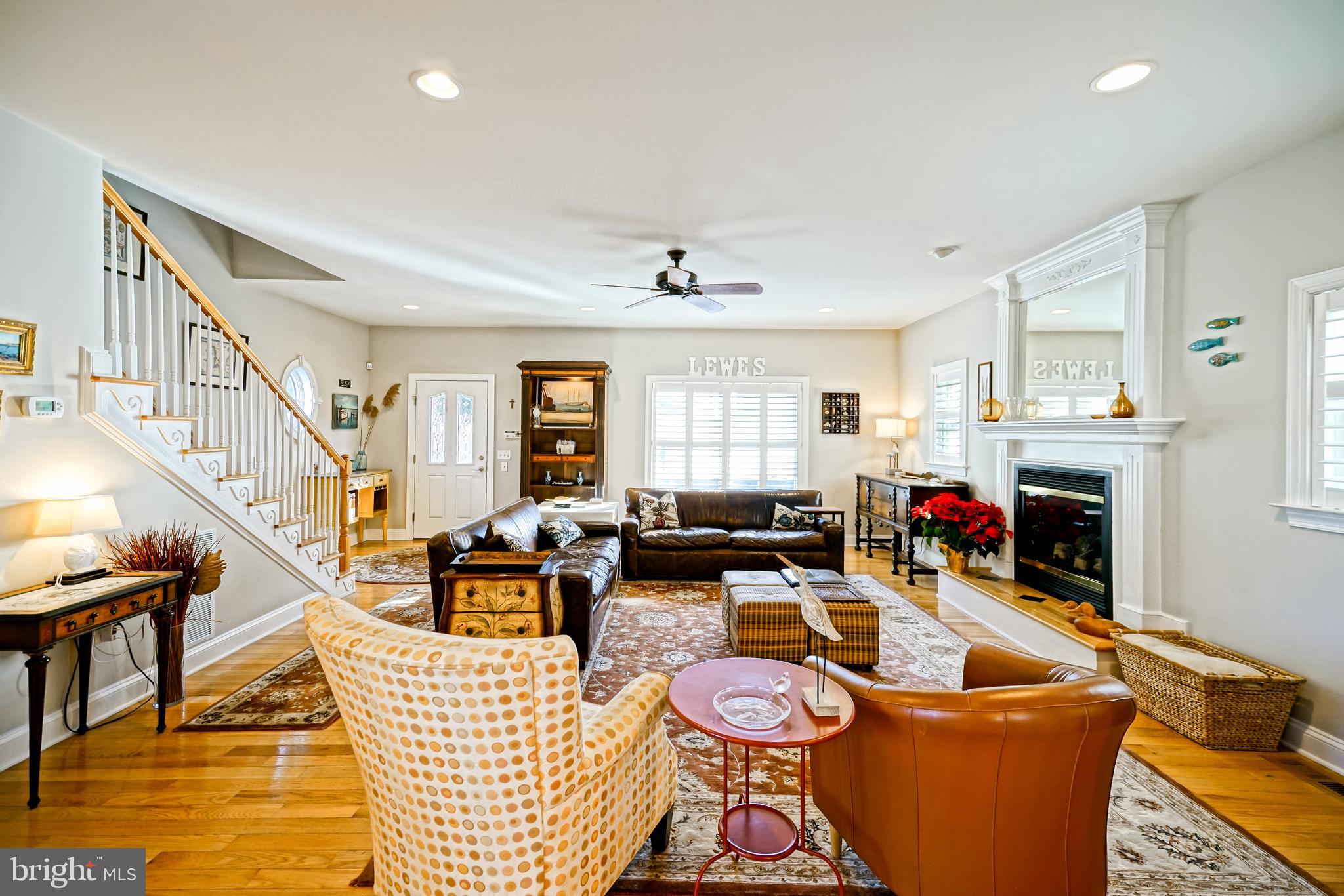 412 Mulberry Street Lewes, DE 19958 - Photo 10 of 74 a living room with patio furniture and a fireplace