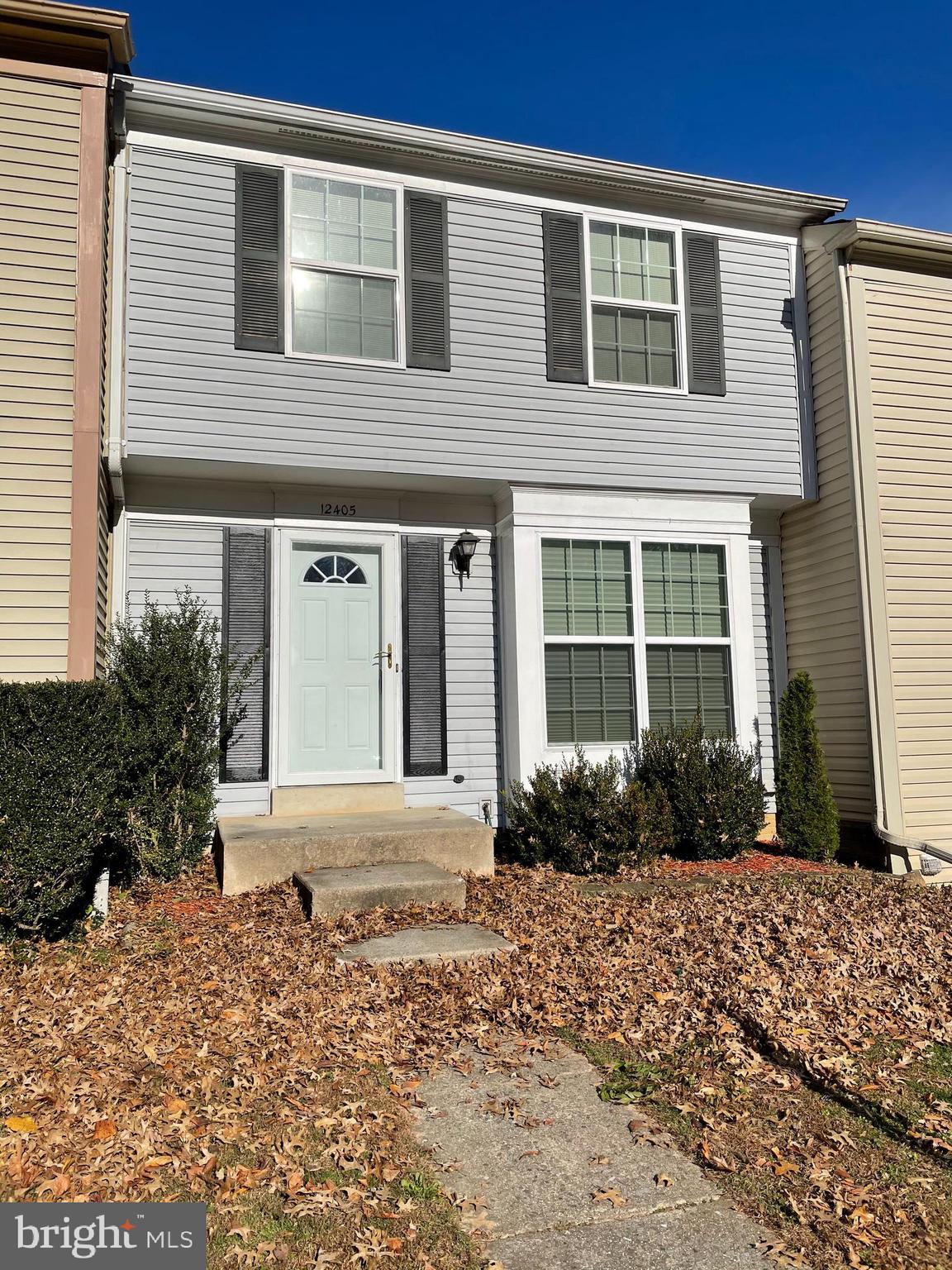 12405 Gooderham Way Gaithersburg, MD 20878 - Photo 1 of 31 a front view of a house with a yard