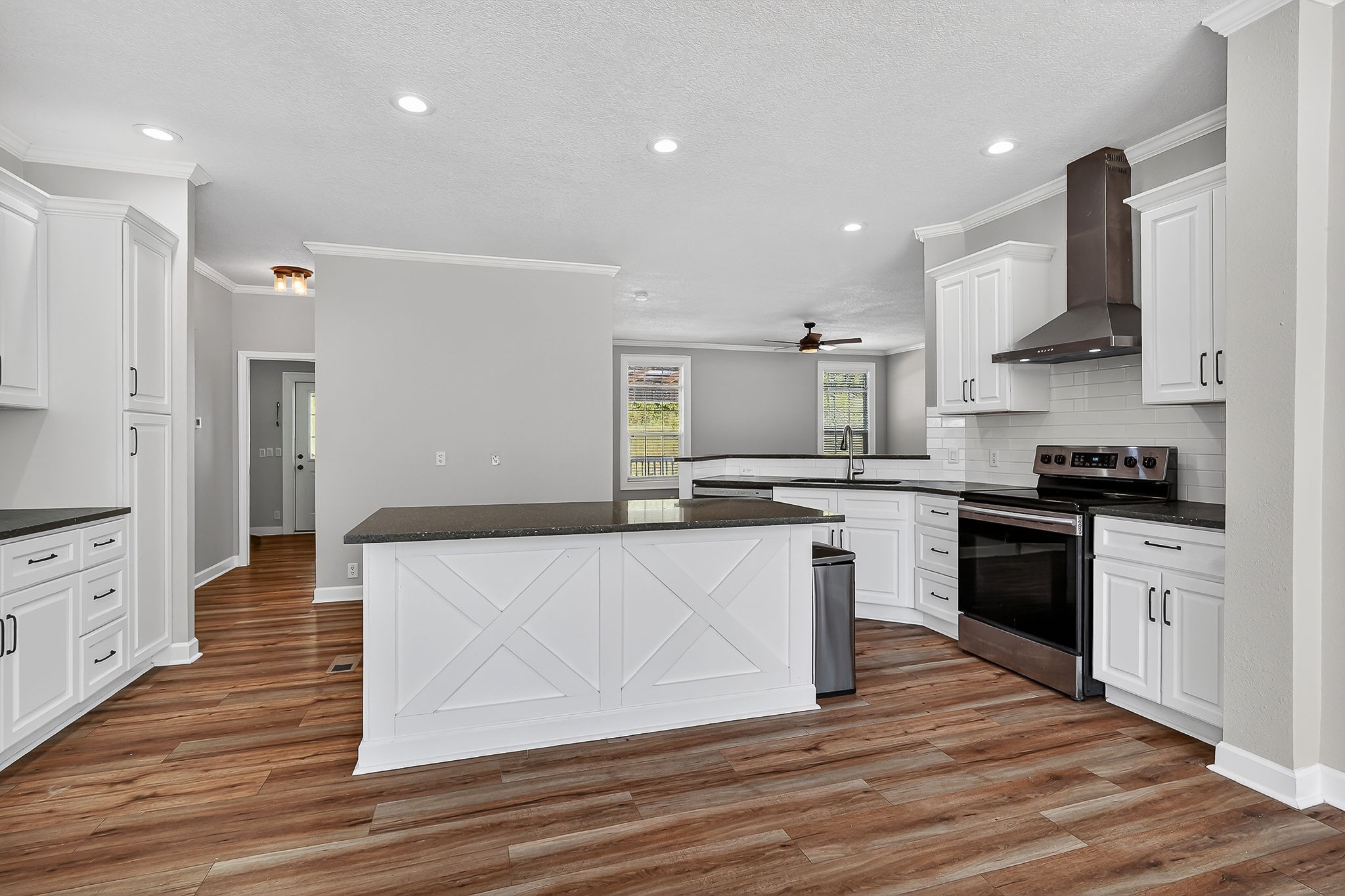 16062 Buffalo Valley Road Silver Point, TN 38582 - Photo 9 of 27 a kitchen with stainless steel appliances kitchen island granite countertop a stove a sink and a refrigerator