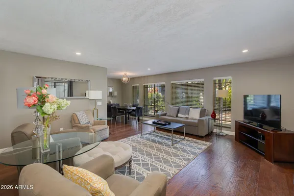 a living room with furniture and a flat screen tv