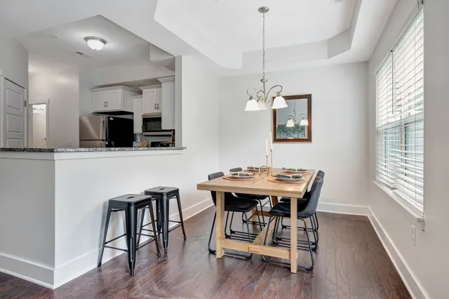 a view of a dining room with furniture window and wooden floor