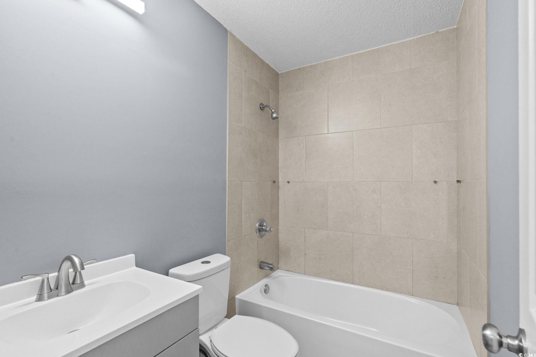 3343 New Road Conway, SC 29527 - Photo 22 of 36 Full bath with shower / bath combination, vanity, and a textured ceiling