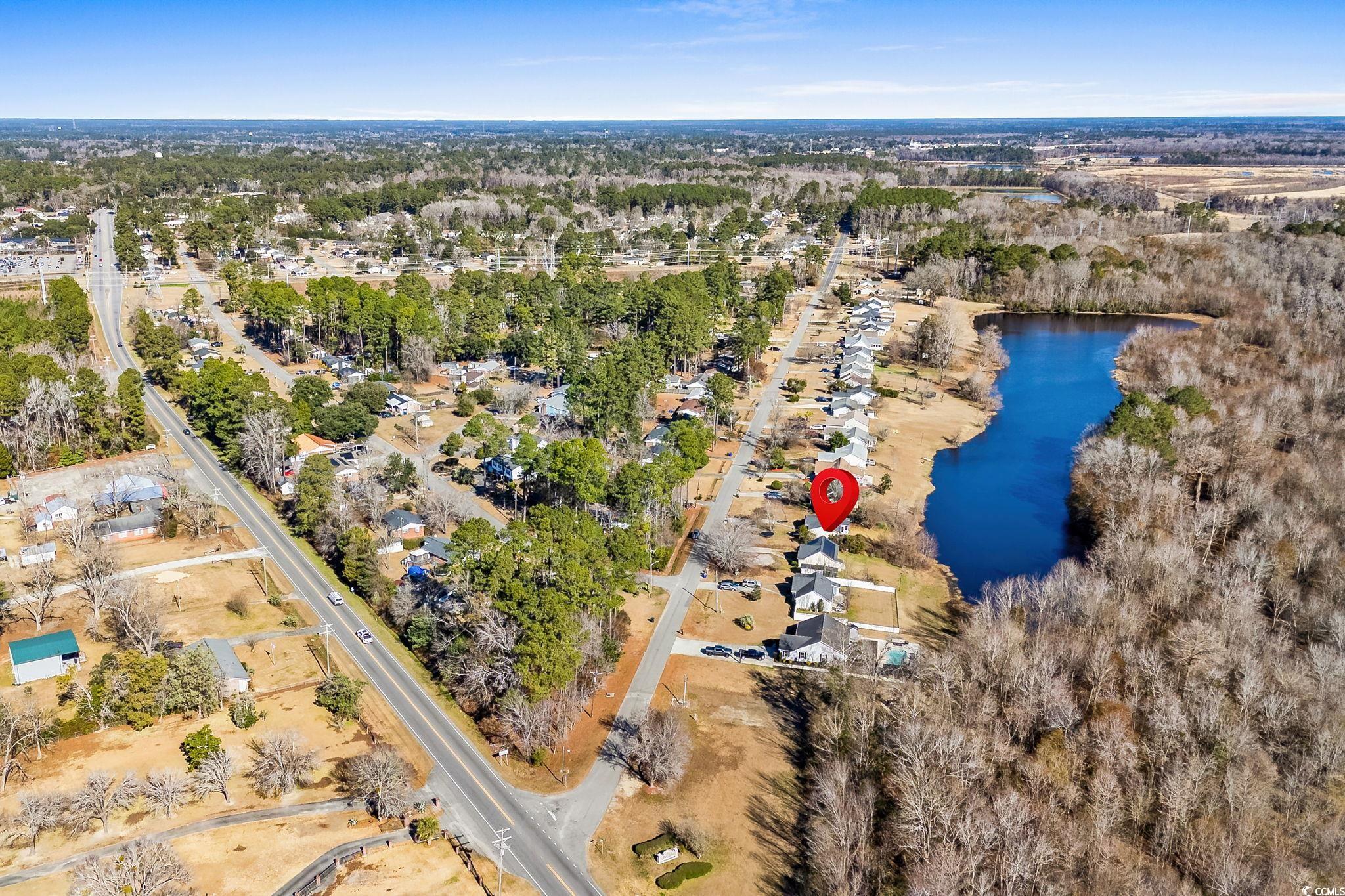 3343 New Road Conway, SC 29527 - Photo 30 of 36 Aerial view of property's location with a large body of water and a tree filled landscape