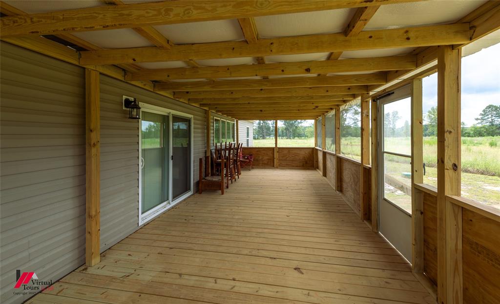 810 Chalybeate Springs Road Plain Dealing, LA 71064 - Photo 35 of 38 Large Fully Screened-In Back Porch