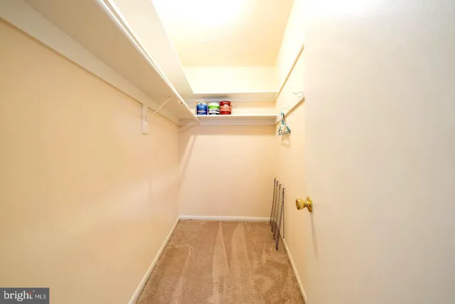 a view of a hallway with stairs