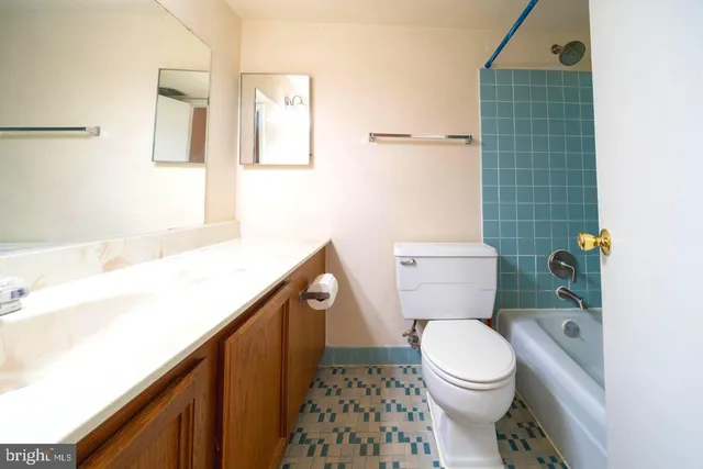 a bathroom with a toilet and a shower curtain