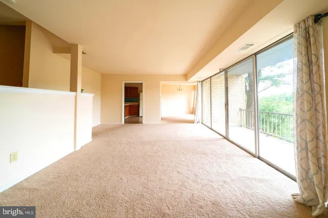 a view of a room with a large window